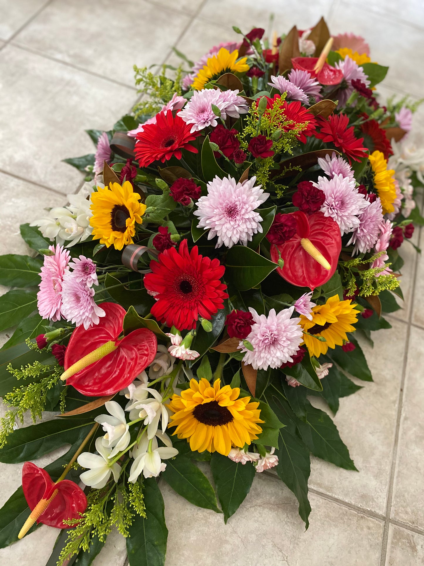 Ray of sunshine casket spray